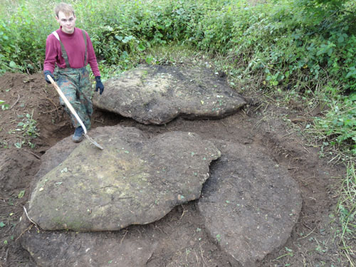 Digger Adam Belk exposing the stones