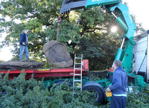 Cliff and Neal Belcher lift and load the Southmoor Henge stones